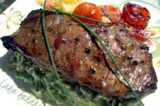 Strip steak with roasted cherry tomatoes and vegetable mash
